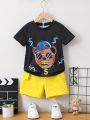 SHEIN Kids QTFun Little Boys' Bear Printed Short Sleeve T-Shirt With Round Neckline And Yellow Shorts 2pcs/Set