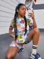 SHEIN Kids Cooltwn Teenage Girls' Fashionable Sporty Graffiti Printed Short Sleeve T-Shirt And Shorts Set With Round Neck