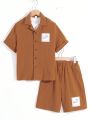 SHEIN Kids SUNSHNE Boys' Casual Solid Color Shorts & Woven Short-Sleeved Top Two-Piece Set, With Stick Decoration