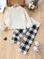 SHEIN Kids EVRYDAY Toddler Girls' Simple Batwing Sleeve Sweater And Plaid Knitted Pants Set