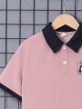 SHEIN Kids EVRYDAY Boys' Loose Fit Casual Color Block Polo Shirt With Turn-Down Collar And Letters Patch, Short Sleeve