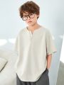 SHEIN Kids KDOMO Tween Boy Casual Korean Style Solid Color Split Neck Loose Fit Knit Short Sleeve T-Shirt