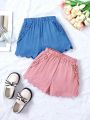 SHEIN Kids CHARMNG Toddler Girls' 2pcs Woven Solid Elastic Waist Pockets & Ruffle Hem Shorts With Frill Decoration