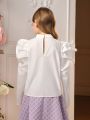 SHEIN Tween Girl Bow Front Gigot Sleeve Mock Neck Blouse