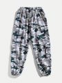 SHEIN Kids HYPEME Tween Boys' Stylish Camouflage Print Joggers With Pockets And Drawstring Waist, Loose Fit