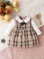 SHEIN Infant Girls' Plaid Dress With Peter Pan Collar And Bow Decoration