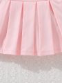 SHEIN Young Girls' Cute Casual Black Sloping Shoulders Ruffle Hem Tank Top And Sweet Pleated Pink Skirt Suit, Perfect For Vacation Style Summer