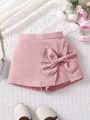 SHEIN Kids Nujoom Young Girls' Solid Color Shorts With Bow Decoration