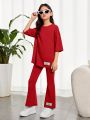 SHEIN Kids EVRYDAY Tween Girls' Casual Comfortable Slogan Printed Round Neck T-Shirt And Flare Pants Set