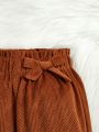 SHEIN Kids QTFun Little Girls' Flared Corduroy Pants With Ruffle Hem And Bowknot Detail