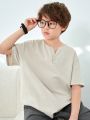 SHEIN Kids KDOMO Tween Boy Casual Korean Style Solid Color Split Neck Loose Fit Knit Short Sleeve T-Shirt