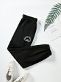 Women's Black Sweatpants With Letter Print And Elastic Cuffs