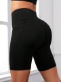 SHEIN Yoga Basic Solid Color Elastic Waistband Sports Shorts With Phone Pocket (Plus Size)