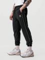 Men Letter Graphic Contrast Piping Drawstring Waist Pants