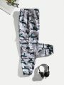 SHEIN Kids HYPEME Tween Boys' Stylish Camouflage Print Joggers With Pockets And Drawstring Waist, Loose Fit