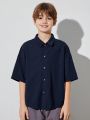 SHEIN Boys' Casual Lapel Super Loose Woven Open Placket Solid Color Short-sleeved Shirt