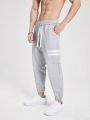 SHEIN Running Men's Drawstring Waist Striped Sports Pants With Slanted Pockets