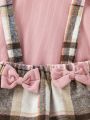 SHEIN Kids QTFun Little Girls' Pink Round Neck Flying Sleeve Top & Plaid Overall Dress With Bowknot, 2pcs/set