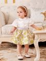 SHEIN Baby Girl Elegant Satin Bubble Short Sleeve Shirt With Floral Print Skirt Set