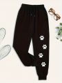 Plus Size Women's Drawstring Joggers With Paw Print Pattern