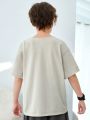 SHEIN Kids KDOMO Tween Boy Casual Korean Style Solid Color Split Neck Loose Fit Knit Short Sleeve T-Shirt