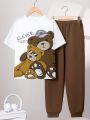 SHEIN Kids EVRYDAY Big Boys' Loose Fit Casual Round Neck Short Sleeve T-shirt And Long Pants Set With Pattern Design