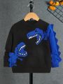 SHEIN Toddler Boys' Daily Dinosaur Printed Patchwork College Style Sweater With Long Sleeve