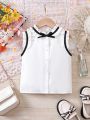 SHEIN Kids FANZEY Little Girls' Woven Solid Color Stand Collar Sleeveless Shirt With Ruffle Trim, Slim Fit, Elegant And Casual