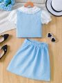SHEIN Kids HYPEME Tween Girl'S Contrasting Color Doll Collar Short-Sleeved Top And Skirt Set