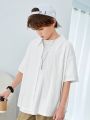 SHEIN Kids KDOMO Tween Boys' Casual Korean Style Turn-Down Knitted Jacquard Open-Front Loose Short Sleeve Shirt