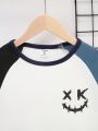 SHEIN Tween Boy Expression Print Colorblock Raglan Sleeve Tee