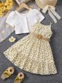 SHEIN Kids CHARMNG Young Girl's Solid Color Hollow Knit Top And Small Floral Cami Dress Set