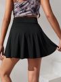 SHEIN Teenage Girls' Solid Color Skorts With Built-In Light Blocking Shorts And Pockets For Casual & Sports Wear