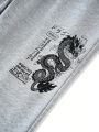 Manfinity EMRG Men Dragon & Letter Graphic Slant Pocket Pants