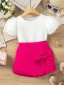 SHEIN Kids Nujoom Little Girl's Short Puff Sleeve Top And Bowknot Decorated Skirted Leggings Two Piece Set