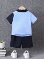 SHEIN Toddler Boys' Casual Color-block Dinosaur Pattern Polo Shirt And Shorts Set