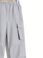 SHEIN Boys' Casual Straight-Legged Solid Woven Pants With Pleats, Stitched Pockets