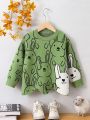 SHEIN Kids QTFun Toddler Girls' Cartoon Rabbit Pattern Irregular Hem Sweater