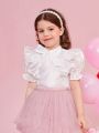 SHEIN Kids CHARMNG Little Girl'S Organza Stand Collar Shirt With Bow Knot Decor, Ruffle Edge Puff Sleeve And Waterdrop Back Collar