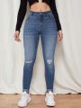 Women's Skinny Ripped Jeans With Water Washing Effect