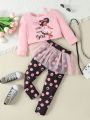 SHEIN Kids QTFun Toddler Girls' Cute Girl Printed Off Shoulder Long Sleeve T-Shirt And Polka Dot Printed Legging Set With Mesh Skirt Overlay