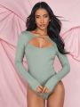 SHEIN BAE Solid Color Hollow Out Long Sleeve Bodysuit