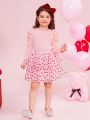 SHEIN Kids CHARMNG Toddler Girls' Leg Of Muttons Sleeve Top With Round Neck & Lantern Sleeve & Multi-Layered Mesh & Heart Pattern Skirt Set