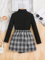 SHEIN Kids FANZEY Girls' Knitted Solid Color Slim-Fit Stand Collar Top And Plaid Skirt Set