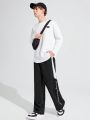 SHEIN Teenage Boys' Casual Loose Fit Side Stripe & Colorblock Patchwork English Print Knitted Straight Leg Pants