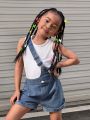 SHEIN Kids Y2Kool Young Girls' Summer Design Sense Casual Sleeveless Vest And Denim Shorts With Oblique Shoulder Strap Set