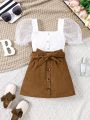 SHEIN Kids FANZEY Girls' Square Neck Spliced Mesh Puff Sleeves Decorative Button T-Shirt And Belt Skirt Two-Piece Set