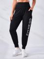 SHEIN Letter Graphic Wideband Waist Sports Pants With Phone Pocket