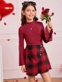 SHEIN Kids FANZEY Girls' Knit Solid Color Stand Collar Top And Knit Plaid Skirt Set