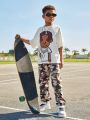 SHEIN Kids Cooltwn Tween Boys' Casual Cartoon Print Round Neck Loose Knit Short Sleeve T-Shirt With Slogan